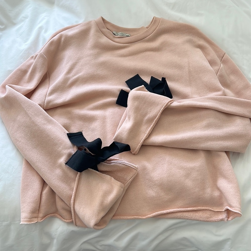 Light Pink sweater, with black bows